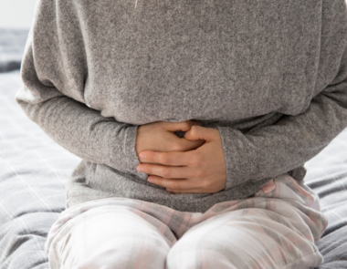 woman with sore stomach